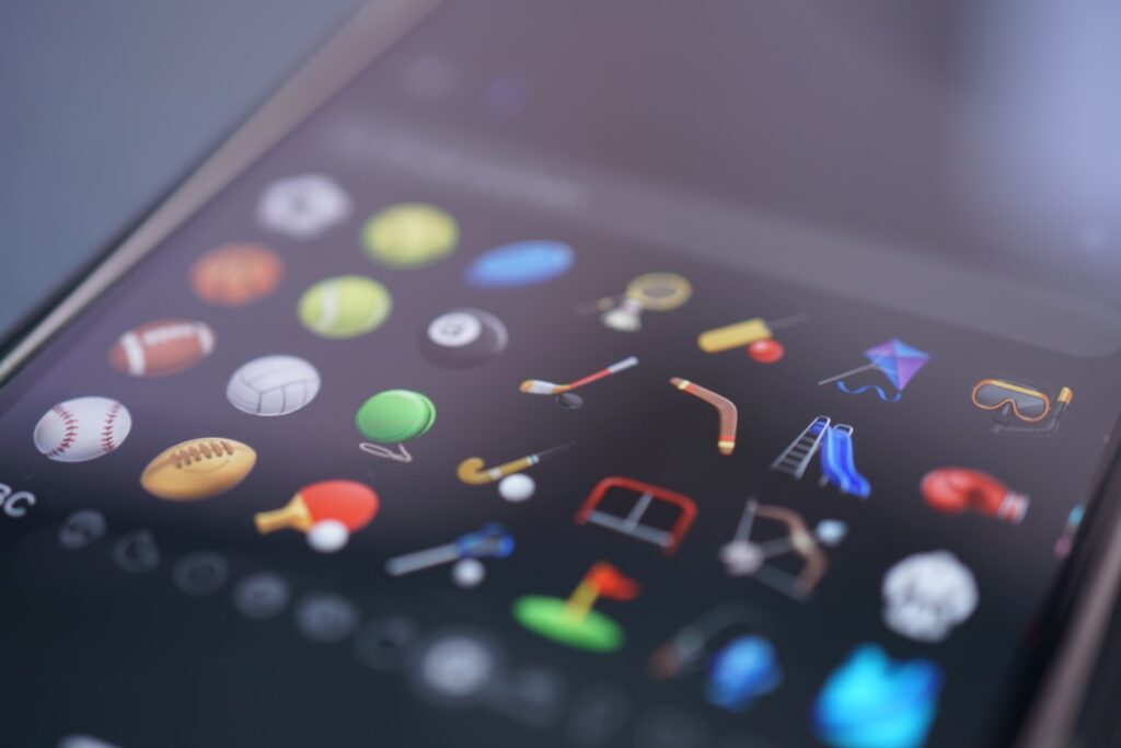Sports icons are displayed on a phone's screen.